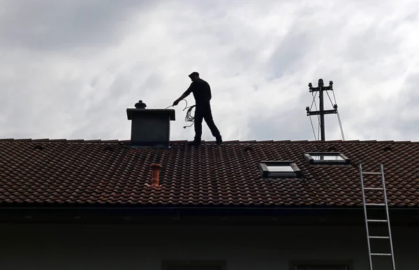 Professional Chimney Technician at Work